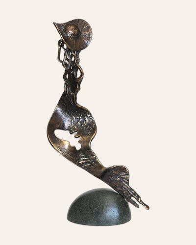 Bronze birdlike form on a rounded dark base