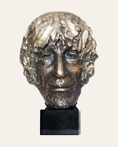 Bronze portrait head on a dark stone base