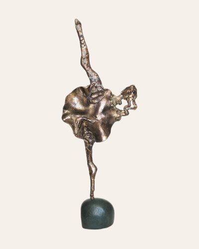 Slender bronze dancing figure on a dark base